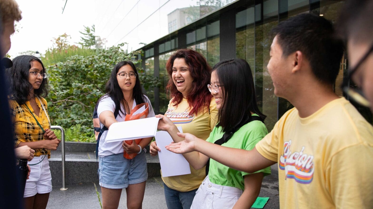 Small group of students talking and laughing