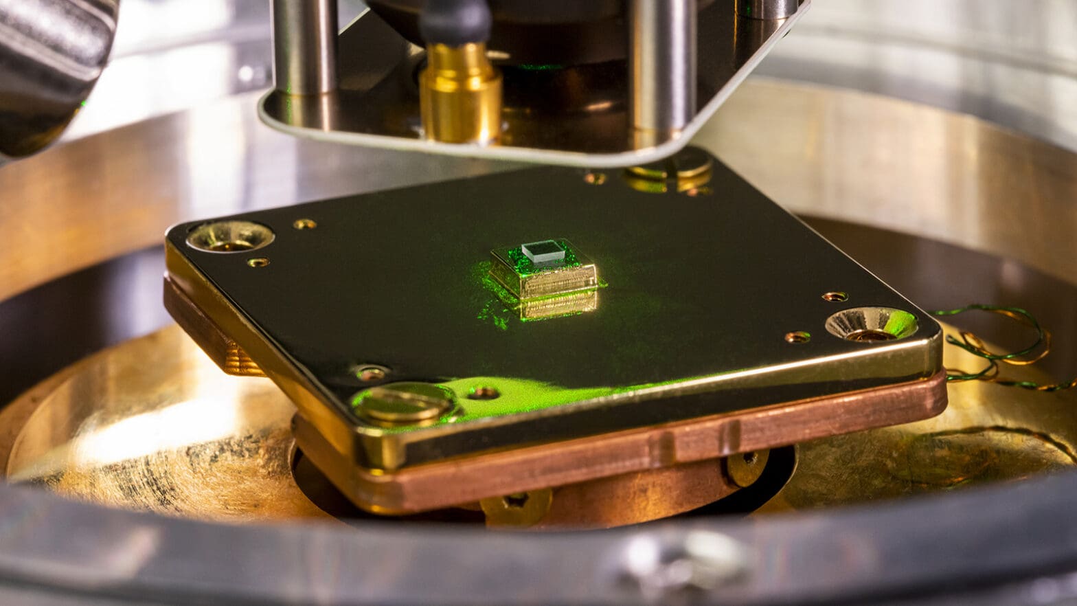 close-up of laboratory equipment holding a square of synthetic diamond.